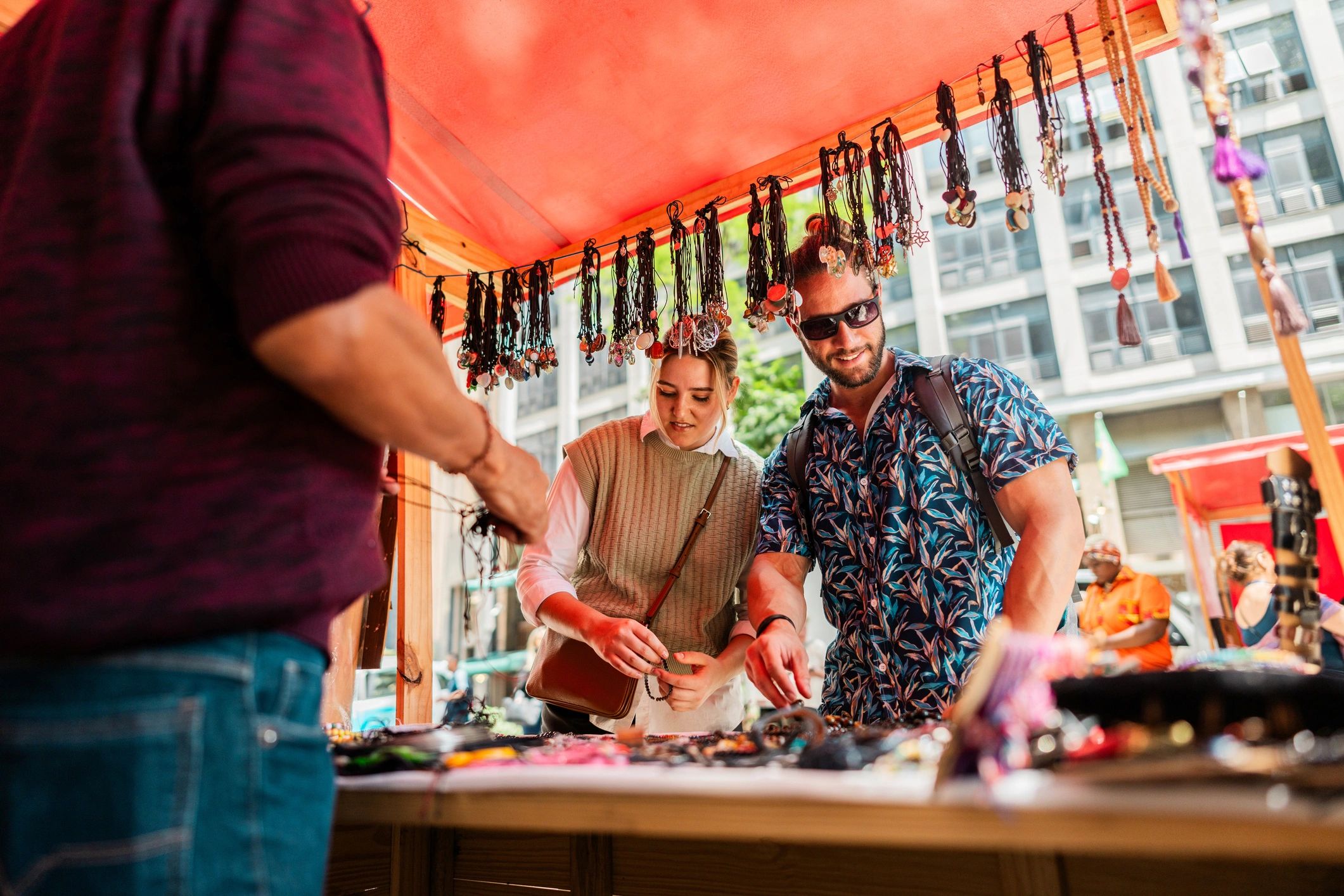 Couple browsing products at a street market