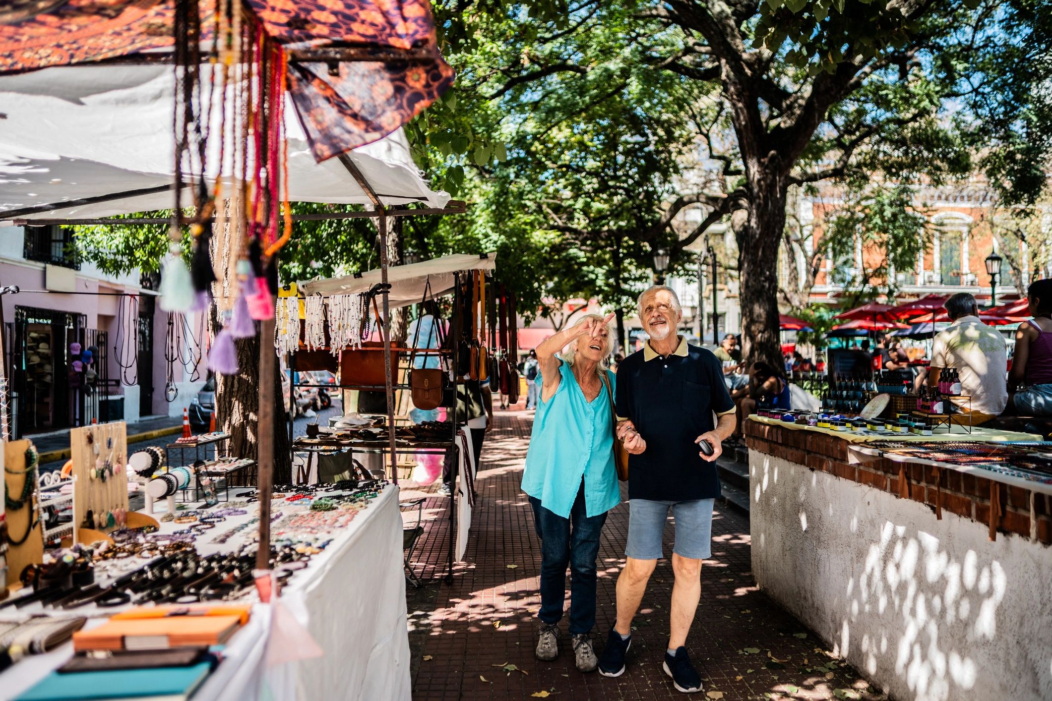 Couple enjoying a stroll through an outdoor artisan market